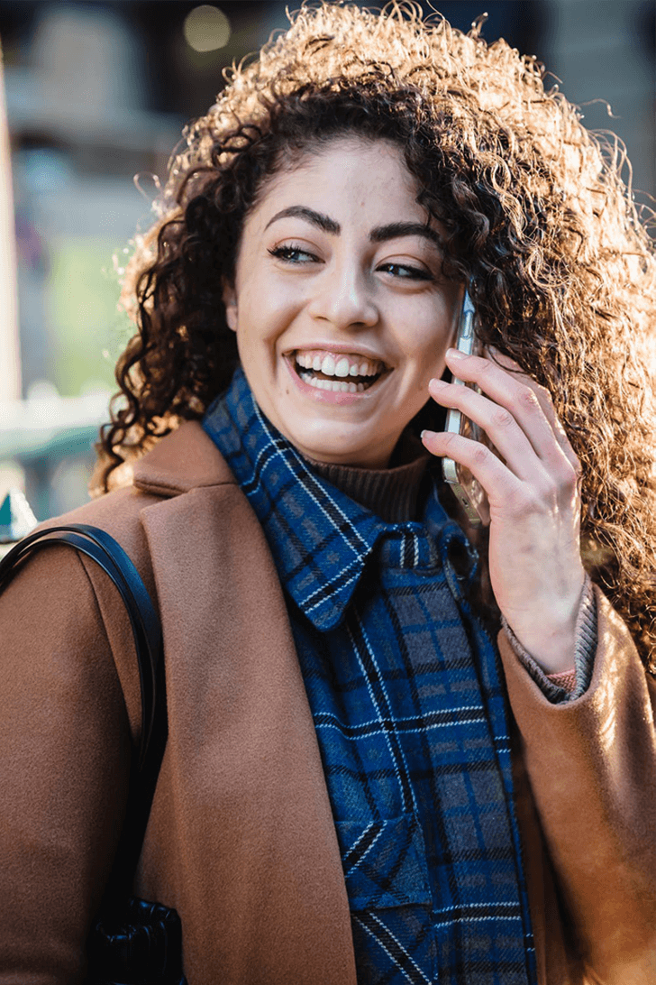 happy female using mobile phone